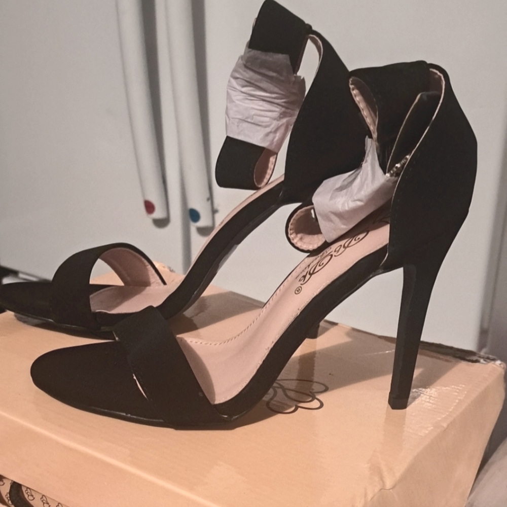 DbDk black strap around ankle heels